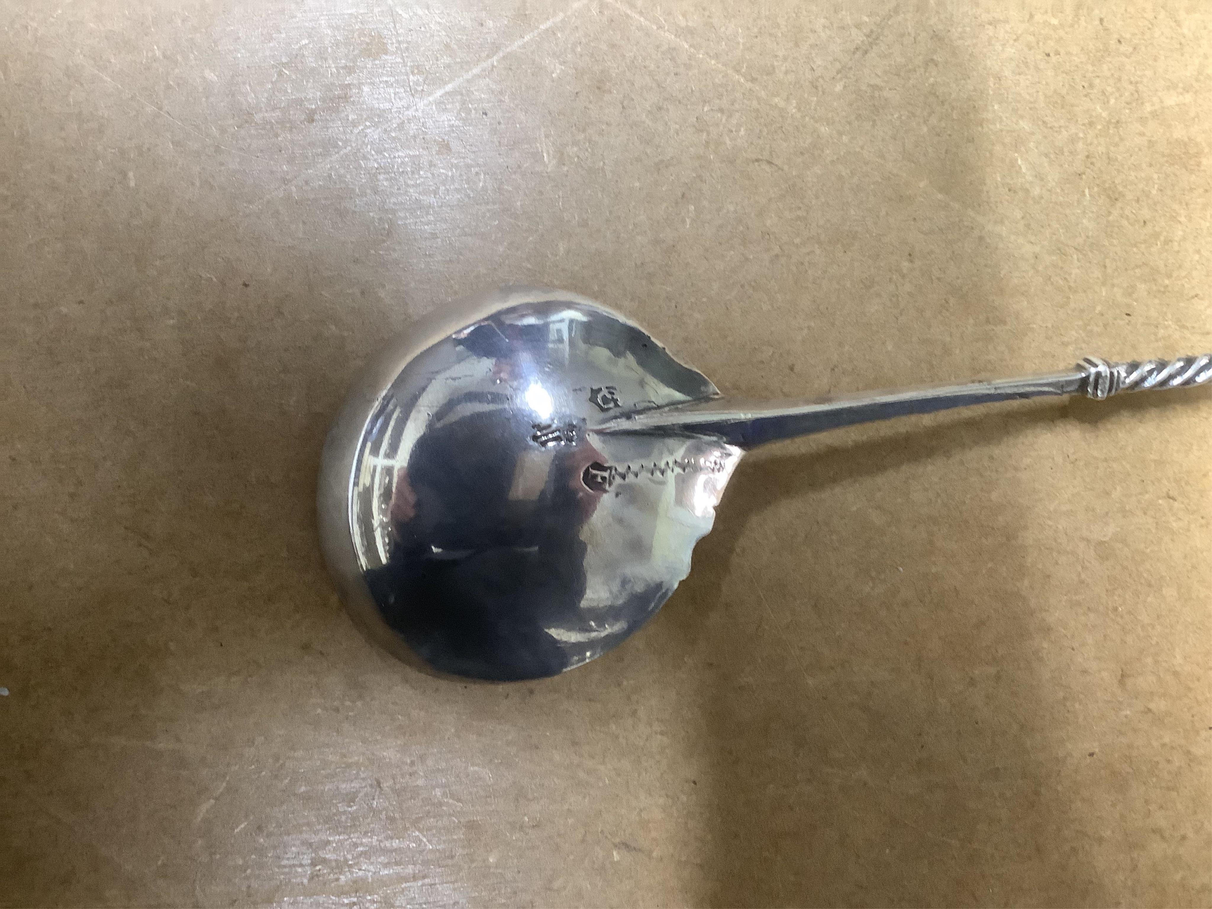 A small French white metal hot water pot, 13cm, a continental white metal bowl (a.f.) and a 19th century German white metal spoon. Condition - poor to fair